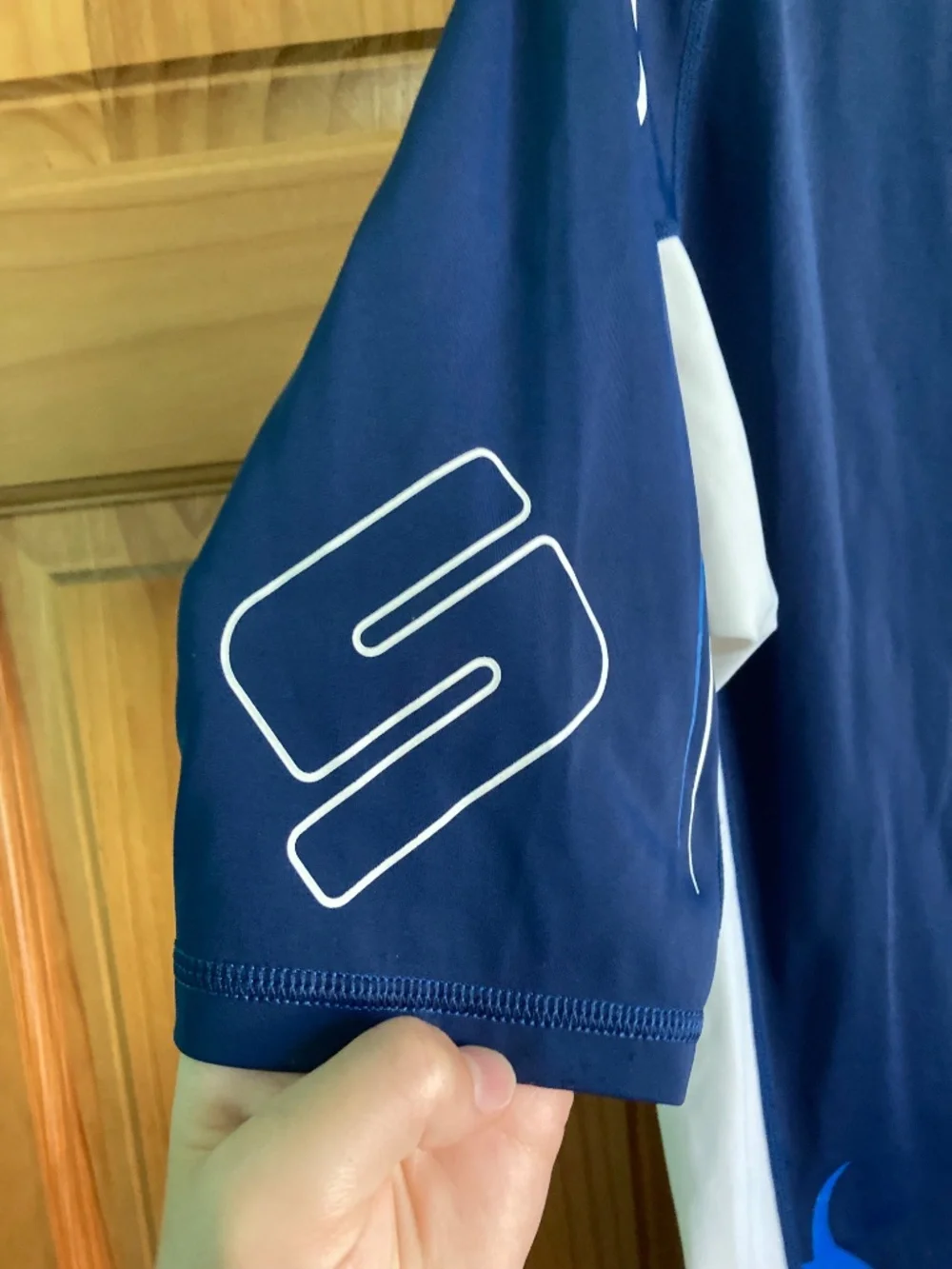 Boy’s size 12/14 Sea-Doo navy blue and white short sleeved swim shirt/rash guard
